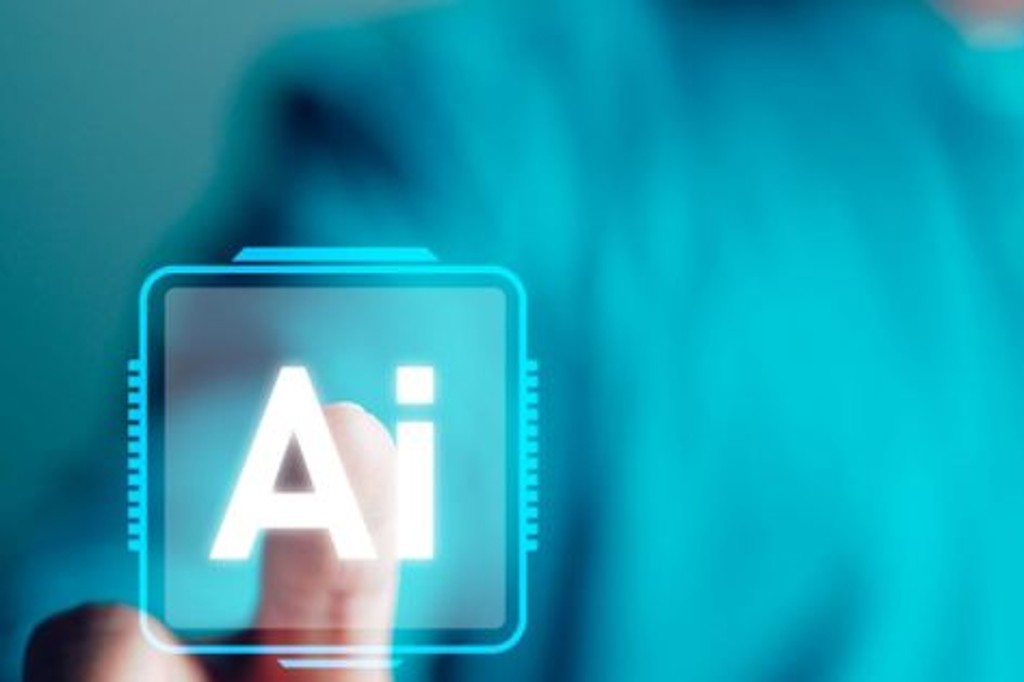 指でタッチしている手が描かれており、ディスプレイには「AI」という文字が表示されている