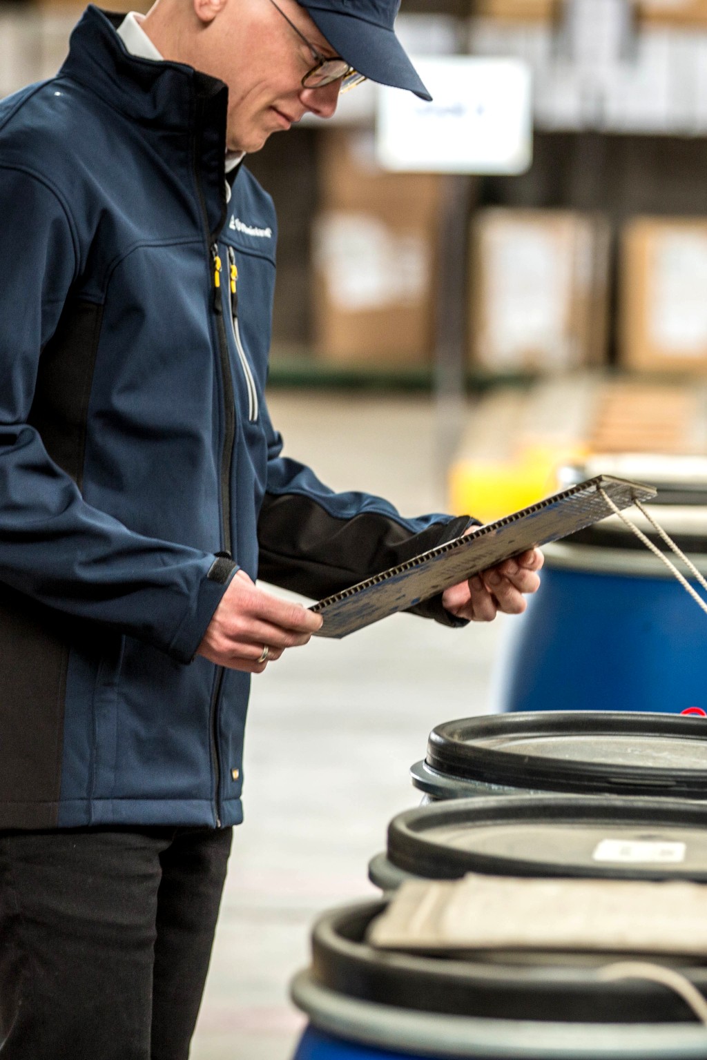 TÜV Rheinland employee is checking chemicals.