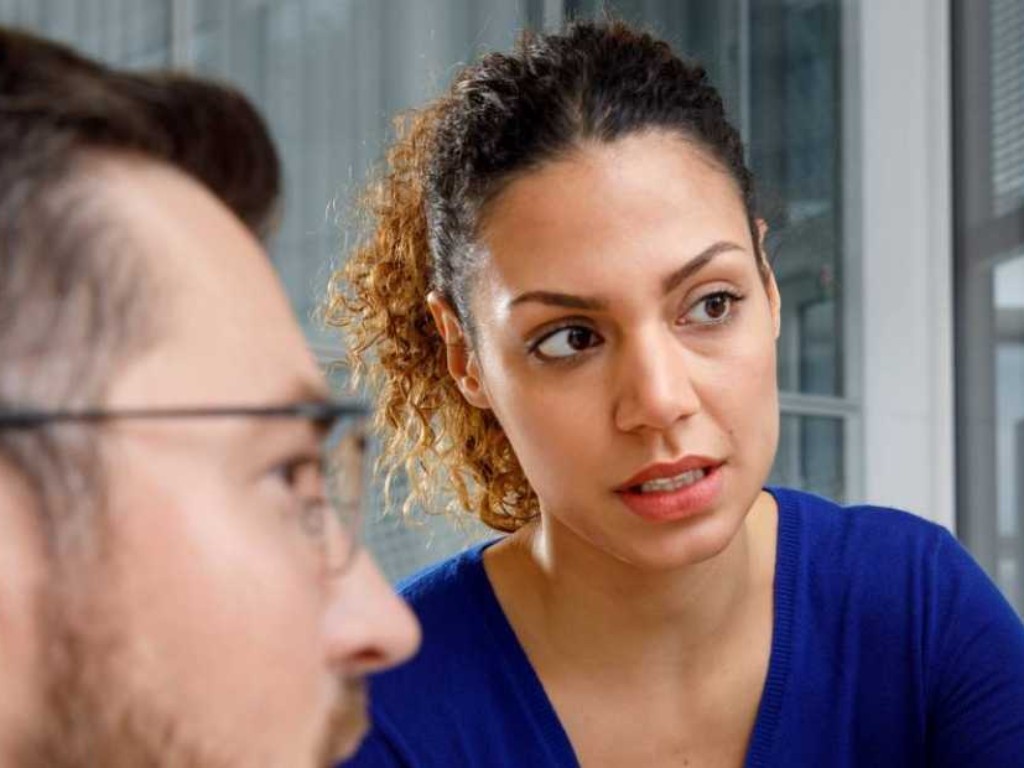 Man and woman looking at laptop 