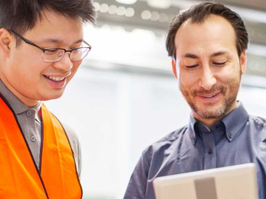 Two men looking at screen 