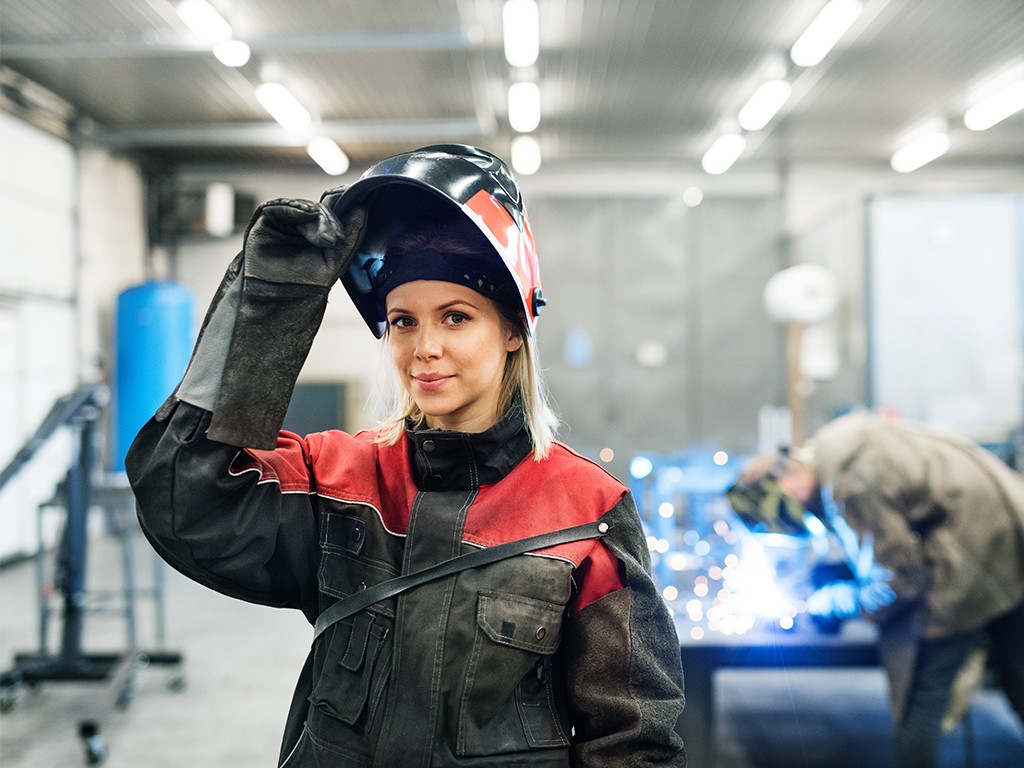 Woman lifts her face shield